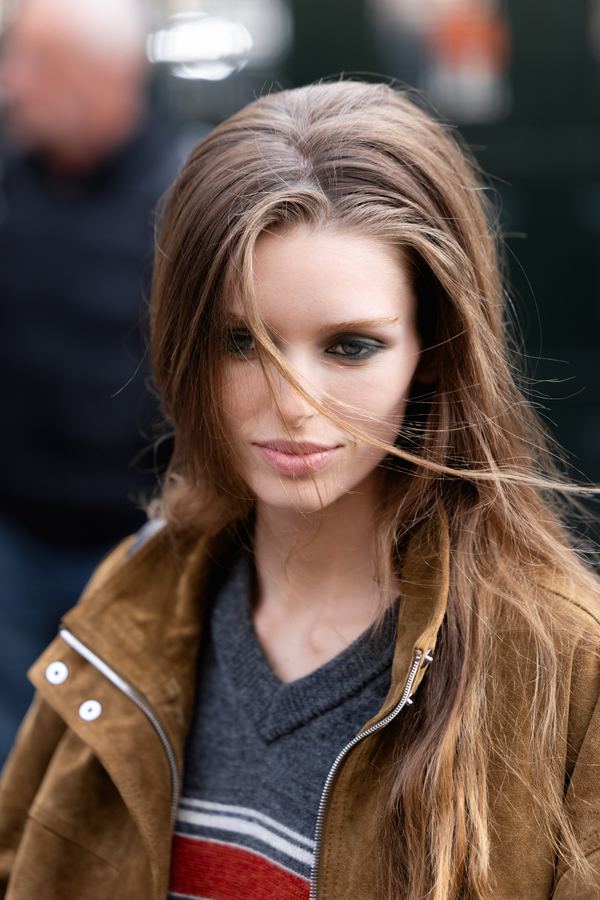 Street style at Paris Fashion Week: brown suede jacket, grey V-neck, Paris