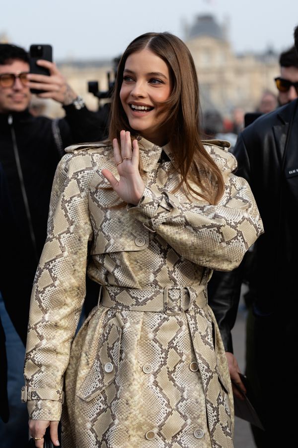 Street style at Paris Fashion Week: python-print trench dress, louvre courtyard, Paris