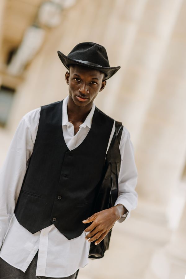 Portrait of a man in black vest, white shirt, black hat, Palais Royal, Paris